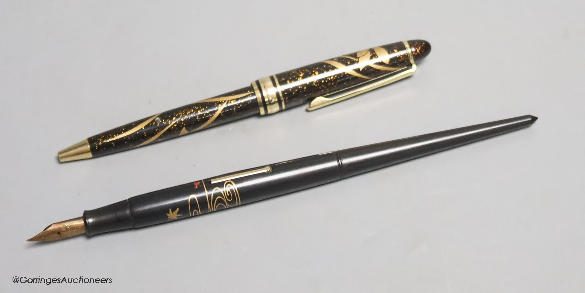 A Japanese lacquer maki-e dip style fountain pen with Dunhill Namiki nib, and a maki-e ballpoint pen